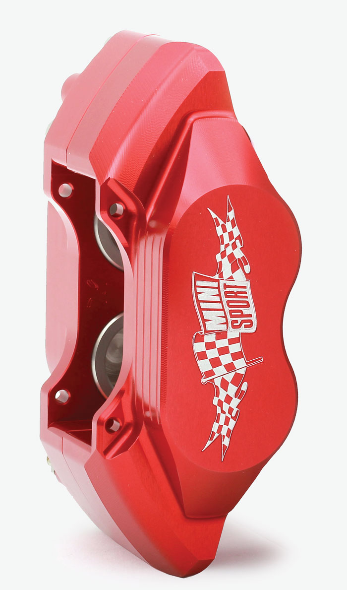 Close-up of a CNC-machined Mini Sport alloy four-piston brake caliper