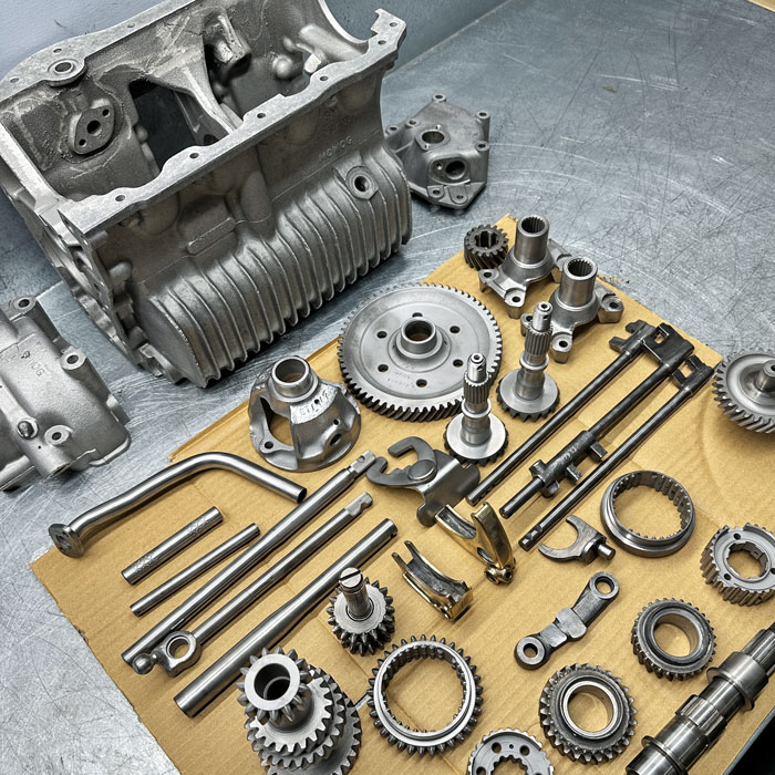 Stripped and cleaned Classic Mini A-Series engine components being inspected at Mini Sport