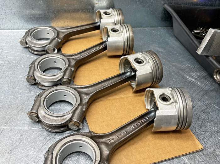 Classic Mini A-Series connecting rods being measured and balanced for engine assembly