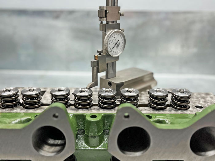Classic Mini A-Series camshaft and rocker assembly being checked during remanufacturing
