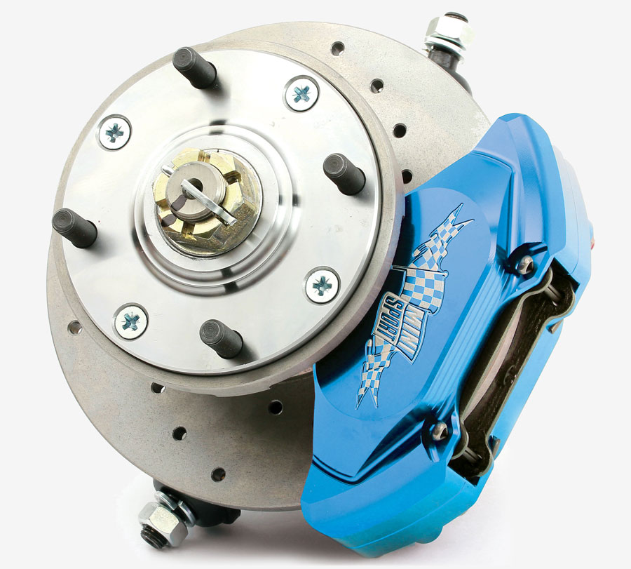 Close-up of a CNC-machined Mini Sport alloy four-piston brake caliper