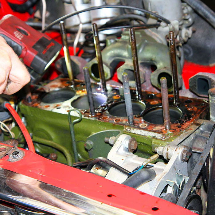 Classic Mini engine component being repaired