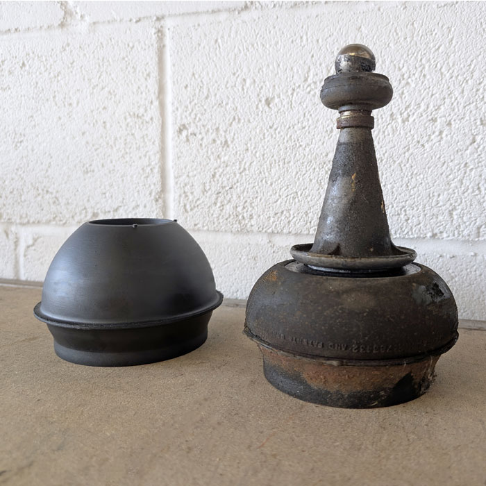 Old compressed Classic Mini suspension rubber cone compared with a new Moulton rubber cone