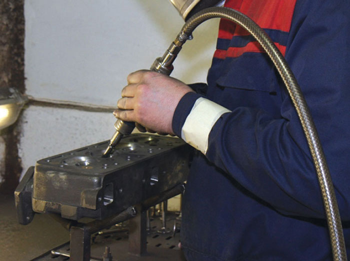 Classic Mini cylinder head being remanufactured in the Mini Sport Engine Plant