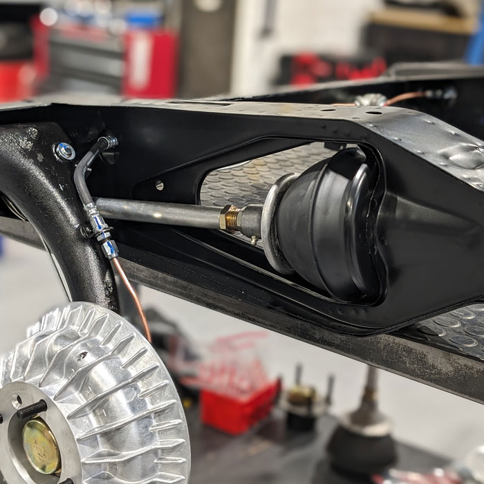 Classic Mini rubber cone suspension showing rubber cone, Adjusta Ride unit, knuckle joint and suspension arm